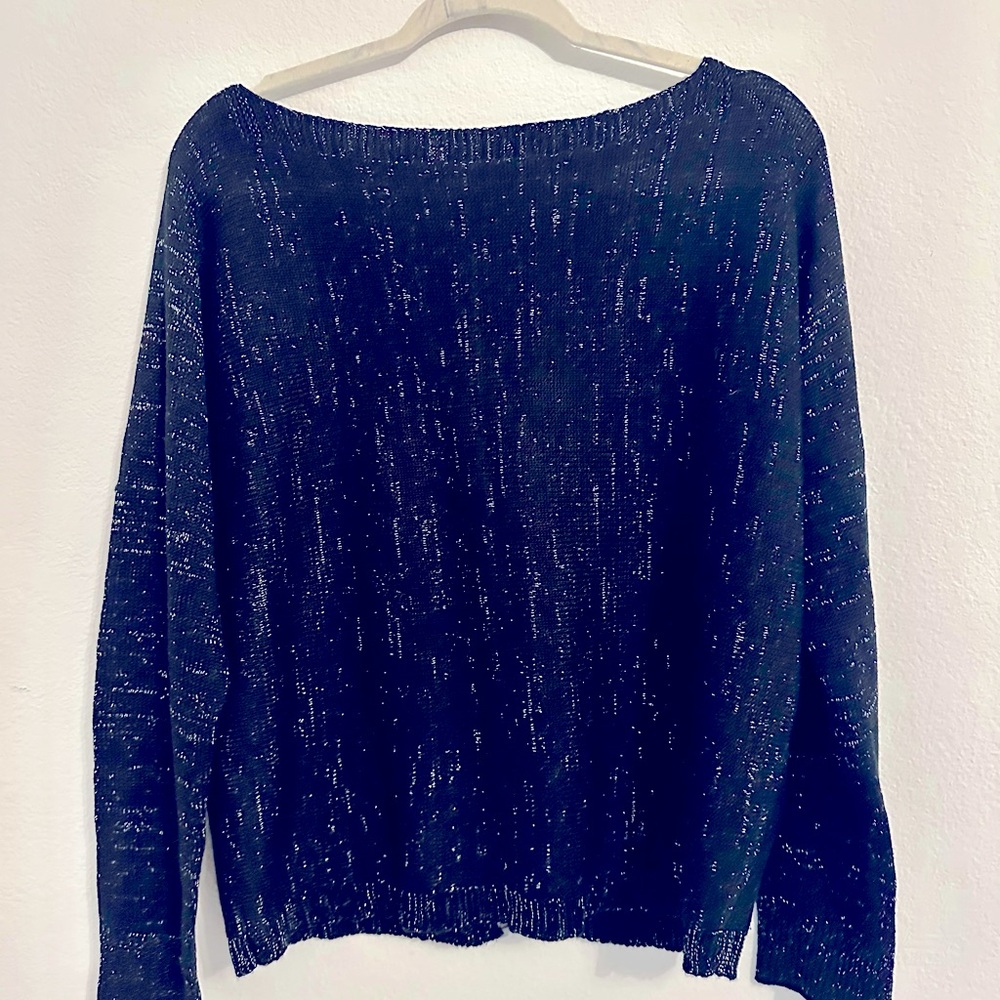 Black and silver metallic sweater with zipper back. Never worn.